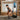 Workout machine with touchscreen; user squats and grips resistance handles