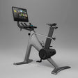 Indoor cycling bike angled view with built-in screen console and resistance flywheel