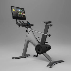 Indoor cycling bike angled view with built-in screen console and resistance flywheel